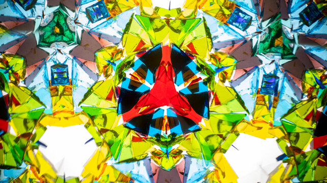 Stunning macro photograph of a natural kaleidoscope pattern showcasing vibrant colors, geometric design, and light reflections, shot with a camera. - Powered by Adobe