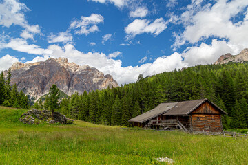 Obraz premium Picturesque tourist hiking trail in the Dolomites in summer
