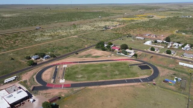 Aerial sunny nature landscape of remote desert town historic route 66 midpoint Adrian Texas TX
