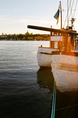 Boats docked at sunset on the waterfront in Stockholm