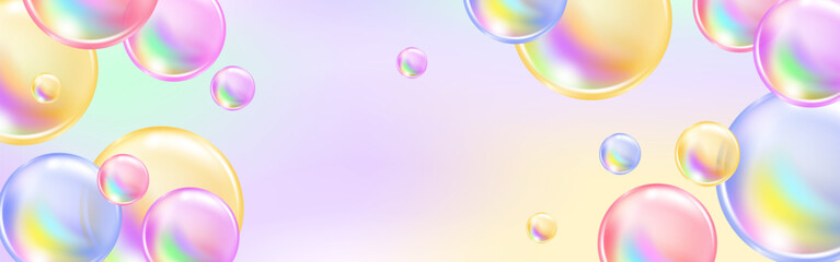 Multicolored spheres and pink bubbles sparkling on a radiant rainbow background.