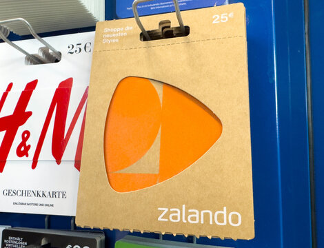 Villach, Austria - November 12, 2025: Zalando gift card displayed on a blue wall with vibrant colors, showcasing modern design and branding for fashion shopping experience