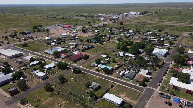 Aerial sunny nature landscape of remote desert town historic route 66 midpoint Adrian Texas TX