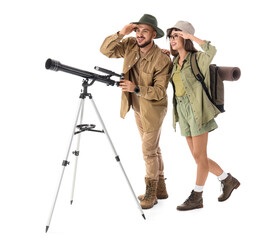 Young couple of travelers with telescope looking at something on white background