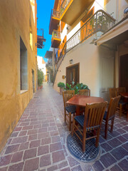 cosy street of Chania old town, Crete, Greece, retro toned