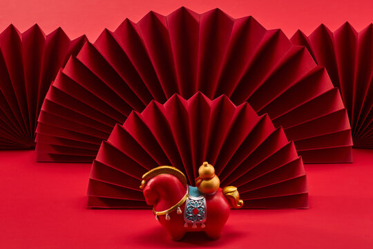 Lunar New Year 2026. New Year background. Red Elegance with Horse Figurine