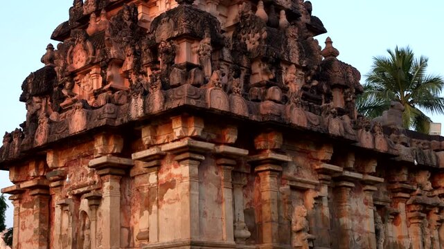 India, Tamil Nadu. 02-11-2025. Thanjavur temple garden at sunset. Panning 4K