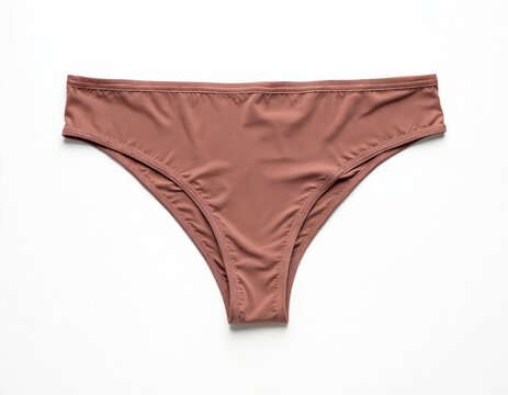 Isolated brown woman panties on white backdrop. Female fashion undergarment. Lingerie panty for lady. Sexy underclothes concept on plain studio background. Apparel for female beauty. Cloth object for