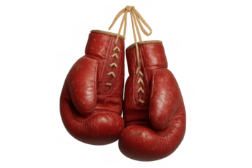 Vintage red boxing gloves hanging, showing sport passion, retirement, and the end of a fighting career