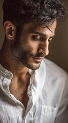 Obraz premium Portrait of a man with thoughtful expression in natural light setting