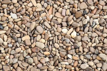 Texture of pebbles as background, top view