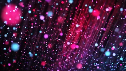 Dancing Particles of Light: A mesmerizing display of vibrant blue, pink, and red particles gracefully swirling across a dark background