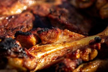 Pork chops, steak, sausages on barbecue grill