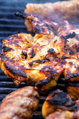 Pork chops, steak, sausages on barbecue grill