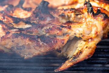Pork chops, steak, sausages on barbecue grill