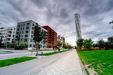 Naklejka premium Modern residential district and Sweden tallest building, the Turning Torso. Neo-futuristic residential skyscraper in Malmö, Sweden.