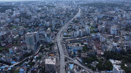 Chattogram city skyline at dusk, Bangladesh, showing modern buildings, glowing lights, and the vibrant atmosphere of the port city.