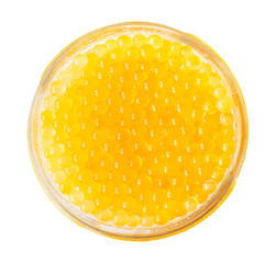 top view of yellow caviar of trout in jar cutout