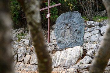 Station VI: Veronica wipes the face of Jesus. The Way of the Cross on Mount Križevac (the Cross Mountain) in Medjugorje.