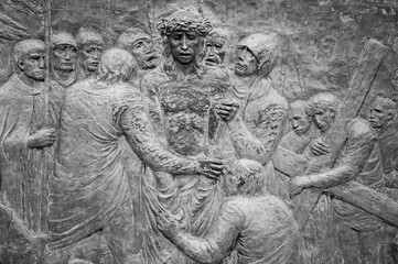 Station X: Jesus is stripped of his garments (Division of robes). The Way of the Cross on Mount Križevac (the Cross Mountain) in Medjugorje.