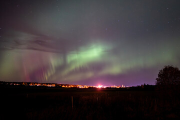 Scenic view of aurora borealis against sky at night