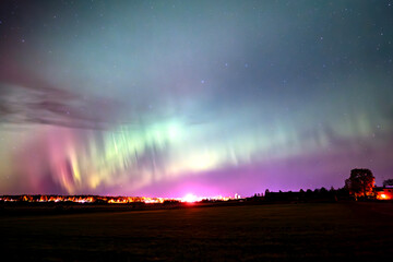 Scenic view of aurora borealis against sky at night