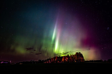 Scenic view of aurora borealis against sky at night
