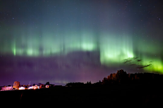 Scenic view of aurora borealis against sky at night