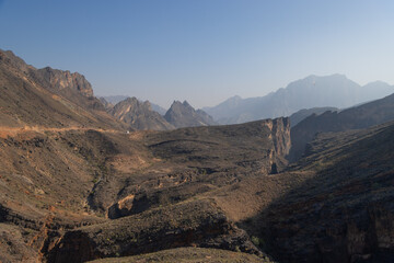 Impressive mountain range in Wadi Bani Awf, a difficult offroad track in Oman with high mountain cliffs