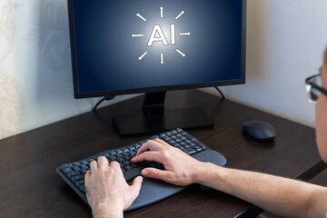 Remote work from home. Hands of person engaged in typing on keyboard, positioned in front of computer screen that showcases an AI concept, creating modern workspace atmosphere with technology focus