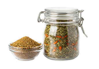 Glass jar filled with dried herbs and spices, closeup