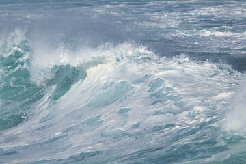 Aqua blue crashing surf on the Maui coast.