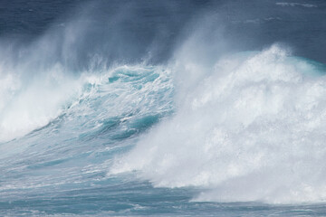 Aqua blue crashing surf on the Maui coast.