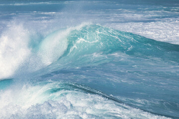 Aqua blue crashing surf on the Maui coast.