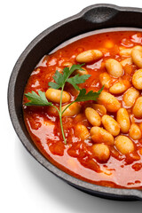 Baked bean dish in cast iron pan on white background. 