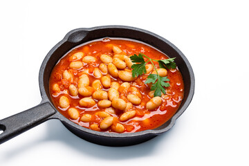 Baked bean dish in cast iron pan on white background. 