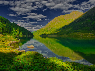 View on Obersee lake and mountains above Defereggental valley on a summer day