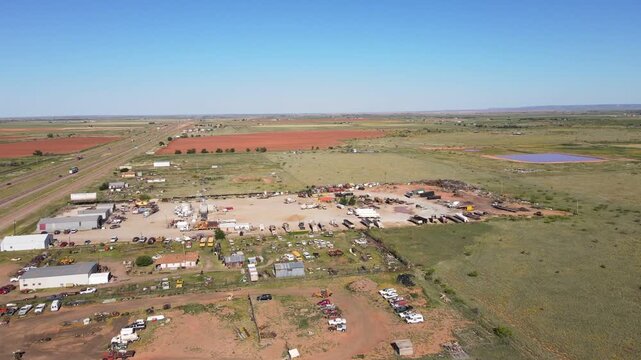 Aerial landscape of abandoned desert car graveyard historic US route 66 San Jon New Mexico NM