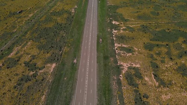 Aerial landscape of small desert road in rural historic US route 66 San Jon New Mexico NM
