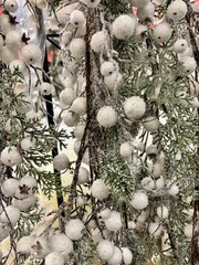 Christmas decor with snowy branches and white ornaments