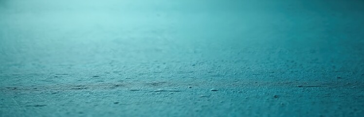 Blue textured paper background with soft light and subtle lines. This handmade material offers a blank canvas for creative projects. It features small bumps and fibers on its surface.