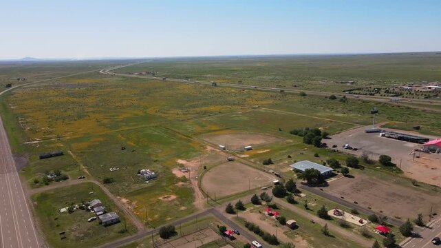 Aerial landscape of small desert road in rural historic US route 66 San Jon New Mexico NM