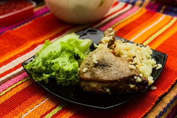 Plant-Based Lentil Patty Meal Over Rice With Fresh Lettuce, Avocado, Fried Onions On Colorful Placemat