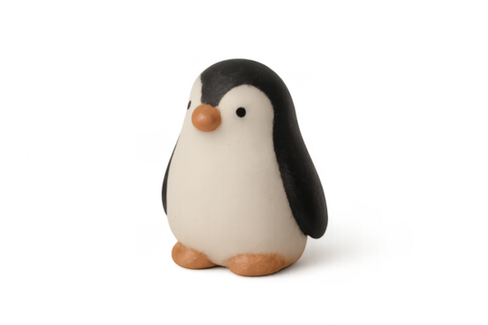 Clay penguin toy with black and white body and orange beak and feet - Powered by Adobe