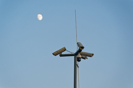 Tall pole with multiple surveillance cameras facing all sides