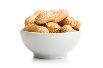 Peanuts in shell. Groundnuts in bowl isolated on white background.