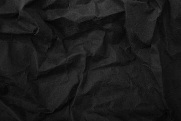 Abstract wrinkled black crumpled paper texture background
