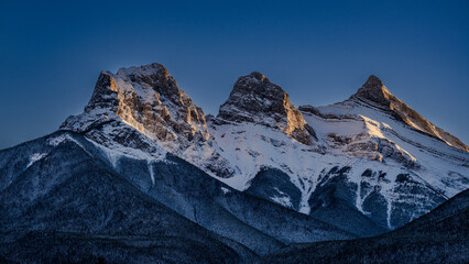 Fototapeta premium Snow covered mountains at sunset