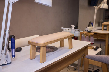 Bright salon setup, Sunshine filled nail station, Well-organized manicure area with city view, Light filled beauty salon featuring organized stations and comfortable environment