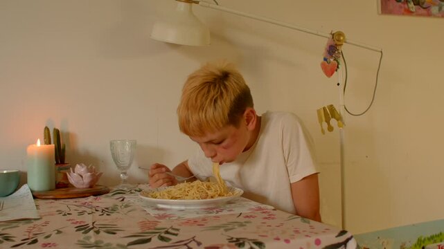 white boy slurping noodles at table, candlelit kitchen, floral tablecloth, curious expression, slow playful bites,